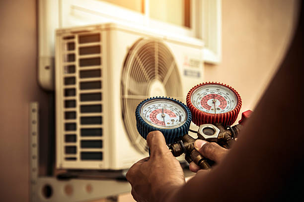 Professional Emergency Hvac technician working in South Walpole, MA